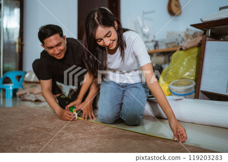 couple of asian production crew marking the fabric material couple of asian production crew marking the fabric material 119203283