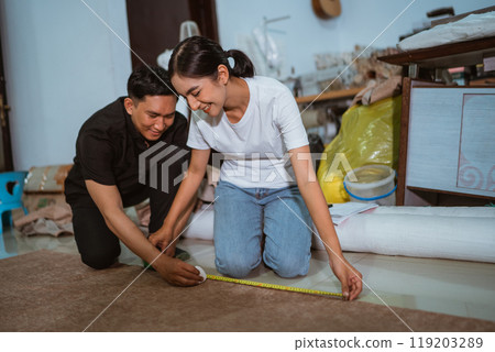 couple of happy asian production crew marking the fabric together couple of happy asian production crew marking the fabric together 119203289