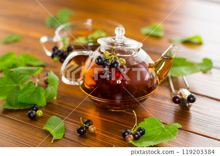 herbal tea from currant leaves and berries 119203384