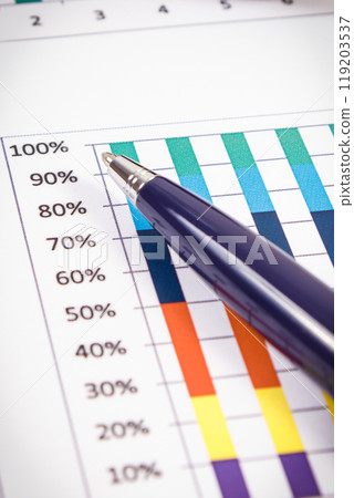 Pen and financial chart showing production or sales statistics. Business Pen and financial chart showing production or sales statistics. Business 119203537