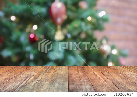 Empty wood table top with blur Christmas tree with bokeh light background 119203654