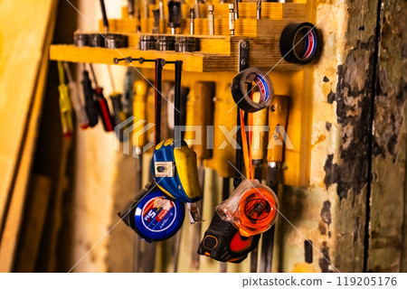 Wall with various carpentry tools. Wall with various carpentry tools. 119205176