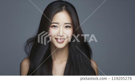 Portrait of a beautiful, sexy, happy smiling Asian woman with long hair, with perfect skin, gray background, banner. 119205278