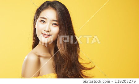 Portrait of a beautiful, sexy, happy smiling Asian woman with long hair, with perfect skin, yellow background, banner. 119205279