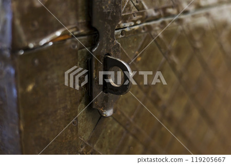 This is a close up image of a metal object that has a hole in it This is a close up image of a metal object that has a hole in it 119205667