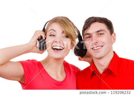 Couple two friends with headphones listening to music Couple two friends with headphones listening to music 119206232