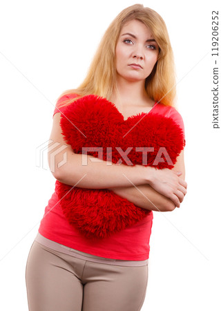 Woman sad girl hugging red heart love symbol Woman sad girl hugging red heart love symbol 119206252