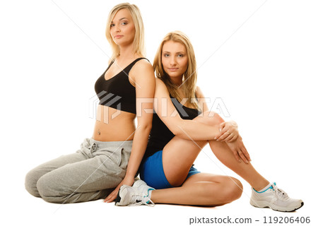 two young sporty women after intense workout 119206406