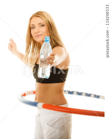 sporty fit girl doing exercise with hula hoop. 119206533