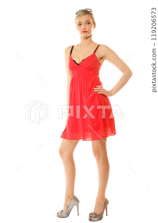 Summer fashion. Pretty fashionable girl in red dress 119206573