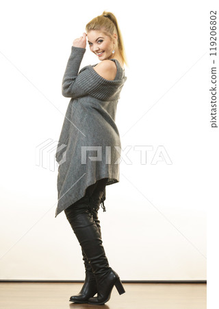 Woman wearing gray long top sweater tunic 119206802