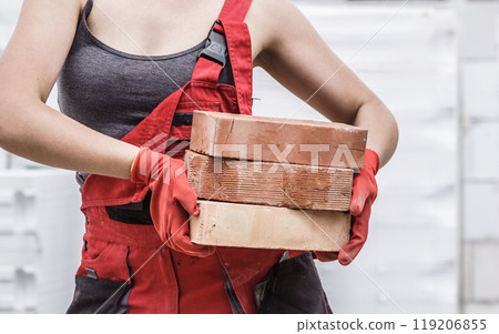 Woman working with bricks 119206855