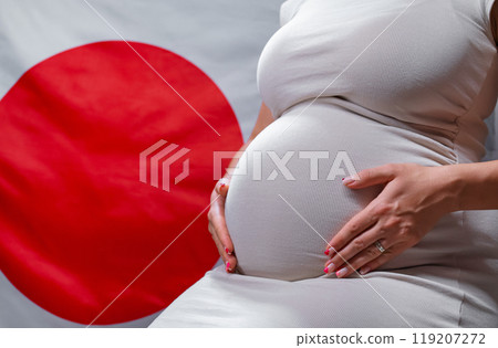 Unrecognizable Future Mother Expecting Baby On Japanese National Flag Background 119207272