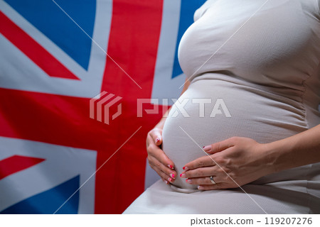 Unrecognizable Future Mother Expecting Baby On Great Britain National Flag 119207276