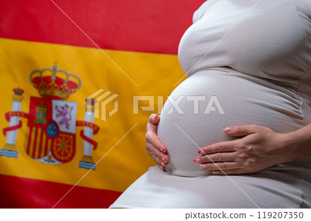Unrecognizable Future Mother Expecting Baby On Spanish National Flag Background 119207350
