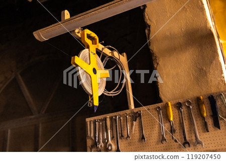 Wall with various carpentry tools. Wall with various carpentry tools. 119207450