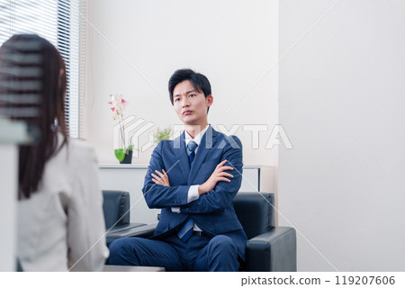 A salesman who becomes arrogant after negotiations break down A salesman who becomes arrogant after negotiations break down 119207606