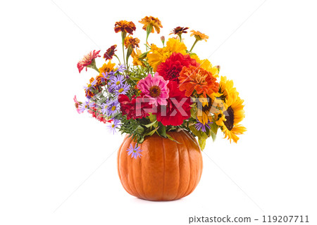 Autumn Floral Pumpkin. A colorful floral arrangement in a pumpkin vase 119207711