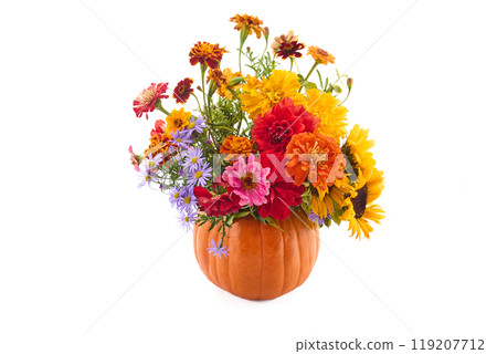 Pumpkin Floral Arrangement. A colorful floral arrangement in a pumpkin vase 119207712