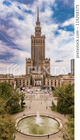 A stunning aerial view of the Palace of Culture and Science in Warsaw, Poland. This iconic skyscraper dominates the city skyline and is surrounded by beautiful parks and squares. A stunning aerial view of the Palace of Culture and Science in Warsaw, Poland. This iconic skyscraper dominates the city skyline and is surrounded by beautiful parks and squares. 119208375
