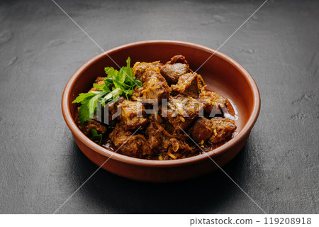 Traditional homemade roasted meat with onions and greens, food photography and culinary blogs Traditional homemade roasted meat with onions and greens, food photography and culinary blogs 119208918