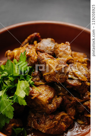 Close up of homemade roasted meat with onions, herbs. Perfect for food blogs, cookbooks, and menus Close up of homemade roasted meat with onions, herbs. Perfect for food blogs, cookbooks, and menus 119208925