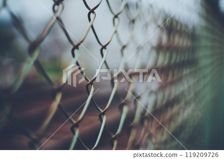 Rusty chain link fence blur 119209726