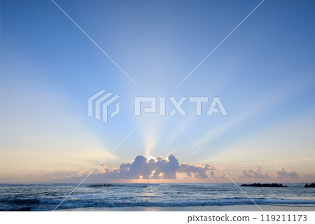 Sunrise from behind the clouds 119211173
