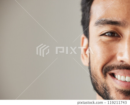Half face, portrait and smile of an asian man in studio with positive mindset, wellness and awareness. Young male model isolated on grey background with happiness, mockup space and confident headshot Half face, portrait and smile of an asian man in studio with positive mindset, wellness and awareness. Young male model isolated on grey background with happiness, mockup space and confident headshot 119211743
