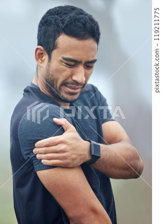 Man, athlete and shoulder pain with fitness outdoor for exercise, training and injury with workout in morning. Person, muscle strain and inflammation in arm with mist for running, routine and sore 119211775