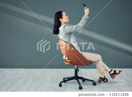 Selfie, video call and woman with a phone for connection, signal and communication at work. Conversation, corporate and Asian employee reading an email, message or chat on a mobile app in an office 119211886
