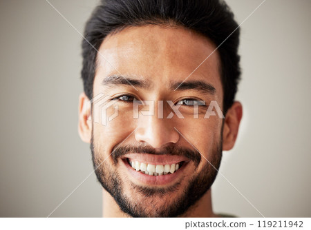 Face, portrait and smile of happy asian man in studio with positive mindset, wellness and awareness. Face of a young male model isolated on a grey background with happiness and confident headshot Face, portrait and smile of happy asian man in studio with positive mindset, wellness and awareness. Face of a young male model isolated on a grey background with happiness and confident headshot 119211942