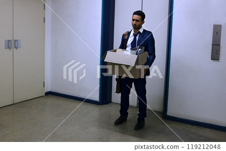 Businessman, fired and sad with box at workplace with unemployment, failure and disappointment on floor. Professional, employee and helpless in corridor of office building with bag, leaving or stress Businessman, fired and sad with box at workplace with unemployment, failure and disappointment on floor. Professional, employee and helpless in corridor of office building with bag, leaving or stress 119212048