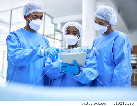 Doctor, tablet and team with mask in meeting, planning or collaboration for surgery at hospital. Group of medical employees with technology in teamwork, consulting or healthcare strategy at clinic 119212180