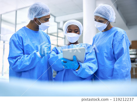Doctor, tablet and meeting with mask in planning or collaboration for surgery ideas at hospital. Group of medical employees with technology in teamwork, consulting or healthcare strategy at clinic 119212237