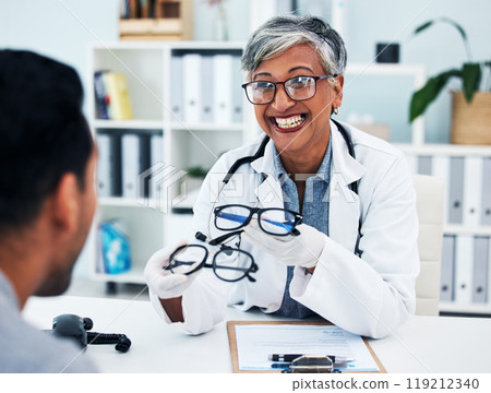 Optometrist, woman and customer with glasses for man or assessment for service at clinic. Eye doctor, professional and advice with frame or consultation with expert for client or helping with smile. 119212340