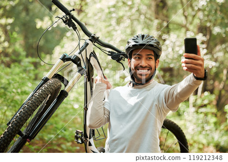 Man, bicycle and forest for selfie, smile and web for wellness, training and blog on adventure. Influencer guy, cycling and mountain bike for profile picture, memory or live streaming on social media Man, bicycle and forest for selfie, smile and web for wellness, training and blog on adventure. Influencer guy, cycling and mountain bike for profile picture, memory or live streaming on social media 119212348