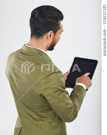 Back, business and man with a tablet, career and professional on a white studio background. Japanese person, employee and accountant with tech, connection and data analysis with investment or trade 119212385