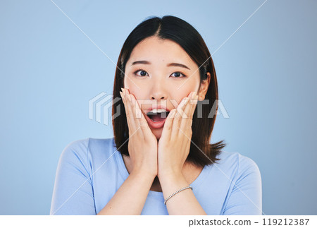 Asian, portrait and woman with surprise from announcement, news or horror story on blue background in studio. Shock, face and person with wow deal, discount or emoji for crazy promotion and offer 119212387