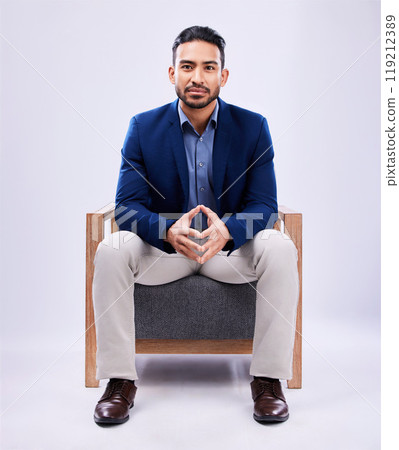 Portrait, lawyer and business man on chair in studio isolated on a white background mockup space. Professional, attorney or confident worker, legal advocate and Mexican advisor in law firm for career 119212389