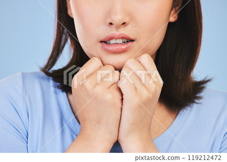 Scared, face and woman with hands in fear, anxiety or stress from news or horror story on blue background in studio. Shock, wow and person with emoji or reaction for crazy announcement or surprise Scared, face and woman with hands in fear, anxiety or stress from news or horror story on blue background in studio. Shock, wow and person with emoji or reaction for crazy announcement or surprise 119212472