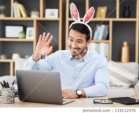 Businessman, bunny ears and video call at home in online meeting with computer screen and wave greeting. Remote work, holiday and rabbit costume for digital education class with male teacher at house 119212476