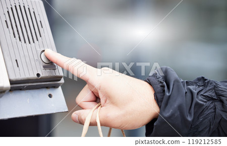 Finger, button and intercom with a person closeup outdoor for entrance through a security communication system. Hand, office building or press with an adult in the city for access via a buzzer 119212585