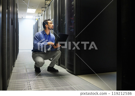 Server room, laptop or man typing for cybersecurity glitch, machine or to search online on servers system. IT support, data center or male engineer fixing network for information technology solution Server room, laptop or man typing for cybersecurity glitch, machine or to search online on servers system. IT support, data center or male engineer fixing network for information technology solution 119212586