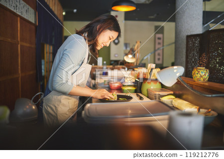 Sushi chef, restaurant and prepare in kitchen with start, service or plate on table, job or catering. Small business, fast food and cooking in cafe, startup diner and smile with fish, rice or seaweed 119212776