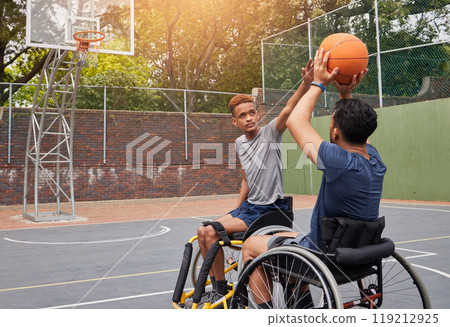 Sports, wheelchair basketball and people shooting ball in match competition, challenge game or fitness practice. Player defence, shot and young athlete with disability, training and exercise on court 119212925
