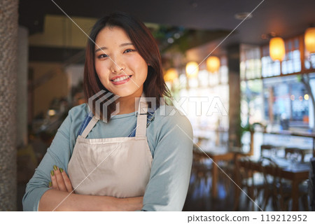 Portrait, happy asian woman or restaurant entrepreneur in small business with arms crossed for professional service. Cafeteria server, coffee shop waitress or confident manager working in hospitality Portrait, happy asian woman or restaurant entrepreneur in small business with arms crossed for professional service. Cafeteria server, coffee shop waitress or confident manager working in hospitality 119212952