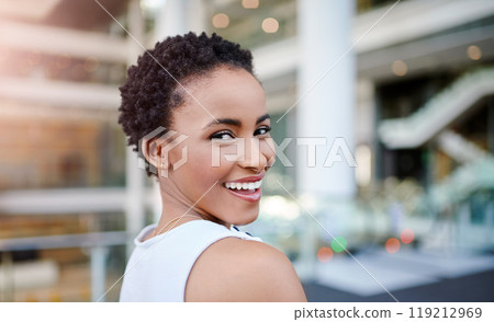 Yup, dreams do come true. Cropped portrait of an attractive young businesswoman smiling while standing in a modern workplace. Yup, dreams do come true. Cropped portrait of an attractive young businesswoman smiling while standing in a modern workplace. 119212969