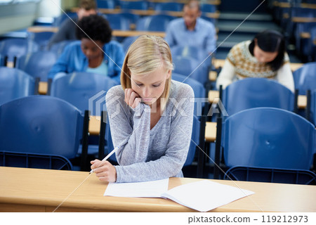 Student, exam and thinking with pen for education with brainstorming, knowledge and assessment at university. Woman, planning and sitting with paper for idea, learning and growth in campus class Student, exam and thinking with pen for education with brainstorming, knowledge and assessment at university. Woman, planning and sitting with paper for idea, learning and growth in campus class 119212973