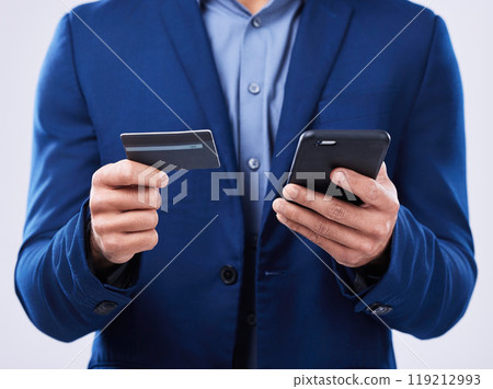 Closeup, hands and a person with a phone and credit card on a studio background for ecommerce. Website, digital or an online customer doing shopping, banking or payment on an easy mobile app 119212993